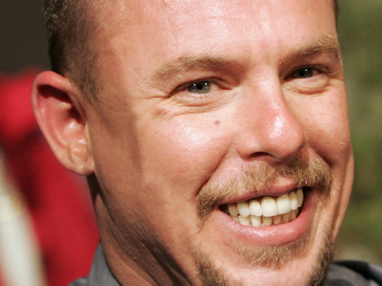 Alexander McQueen, British fashion designer, hangs himself days