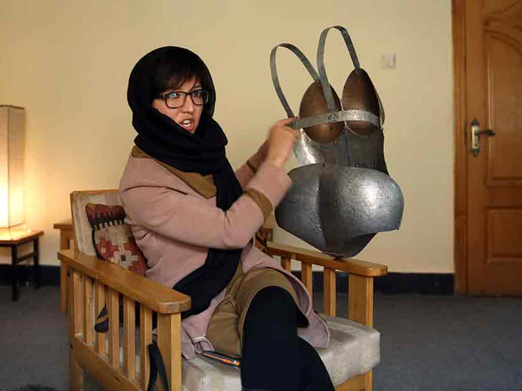 I wish my underwear was made of iron: Afghan woman artist dons armour to  protest street harassment