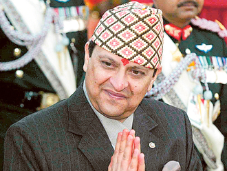 April 21, 2006: Nepal king gives up power