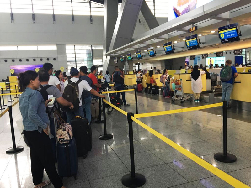 Filipinos checking in at at the Manila International Airport NAIA