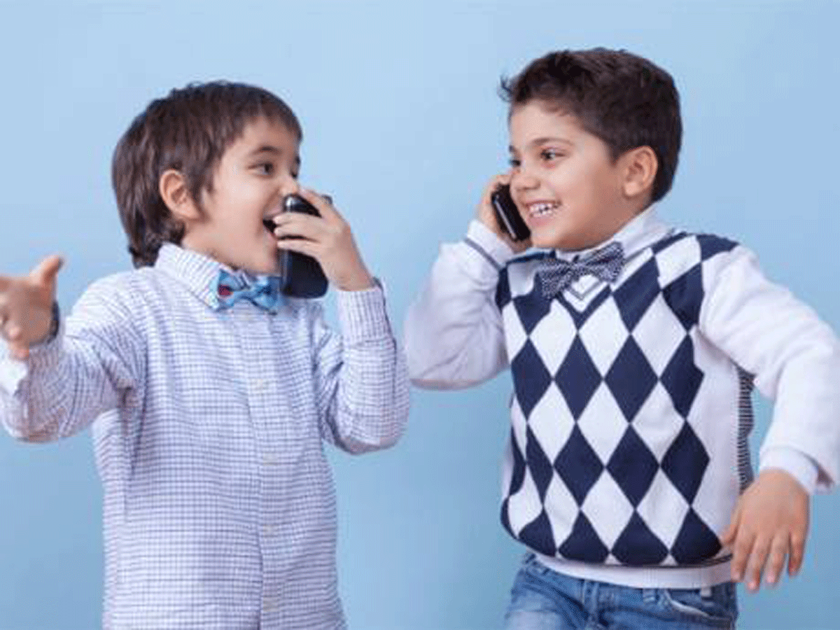 Boys chatting on mobile phones