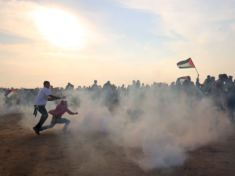 Palestinians run for cover
