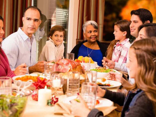 family enjoying Thanksgiving dinner