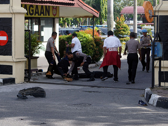 Officer, 4 attackers dead in Indonesia police station ...