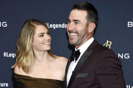 Justin Verlander waves to Kate Upton and baby