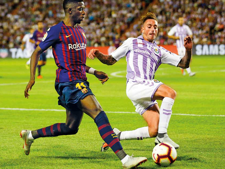 Soccer-Dembele strike gives Barcelona narrow win over Atletico