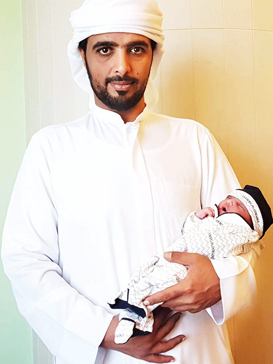 Baby Khalifa Ali Khalfan Al Mansouri with his father.
