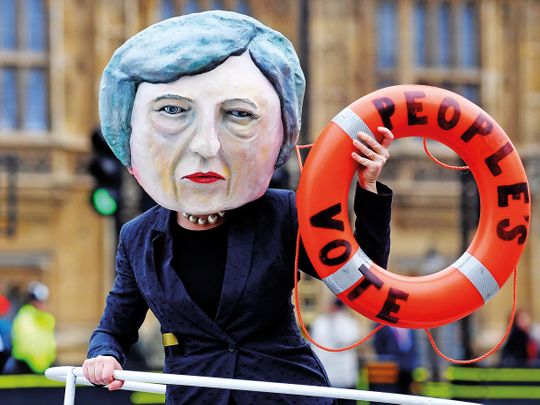 A campaigner dressed as Theresa May