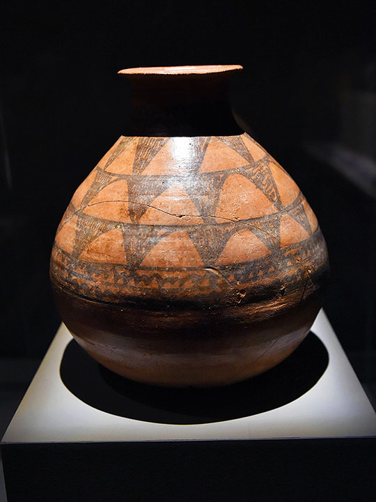 A globular jar with geometrical decoration.
