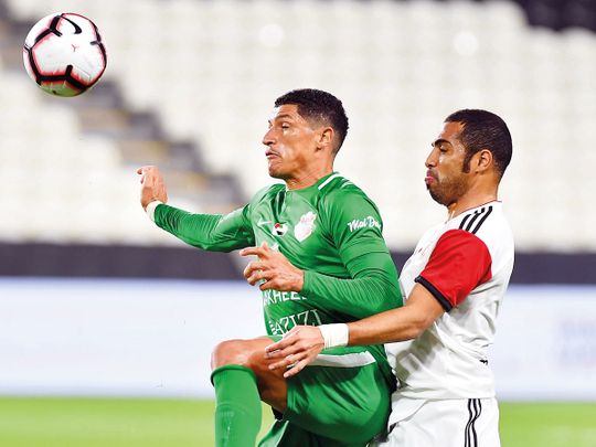 Action from the match between Al Jazira and Shabab Al Ahli