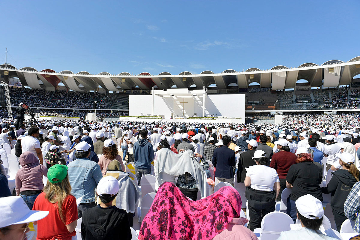 General view of Pope Francis holding 18