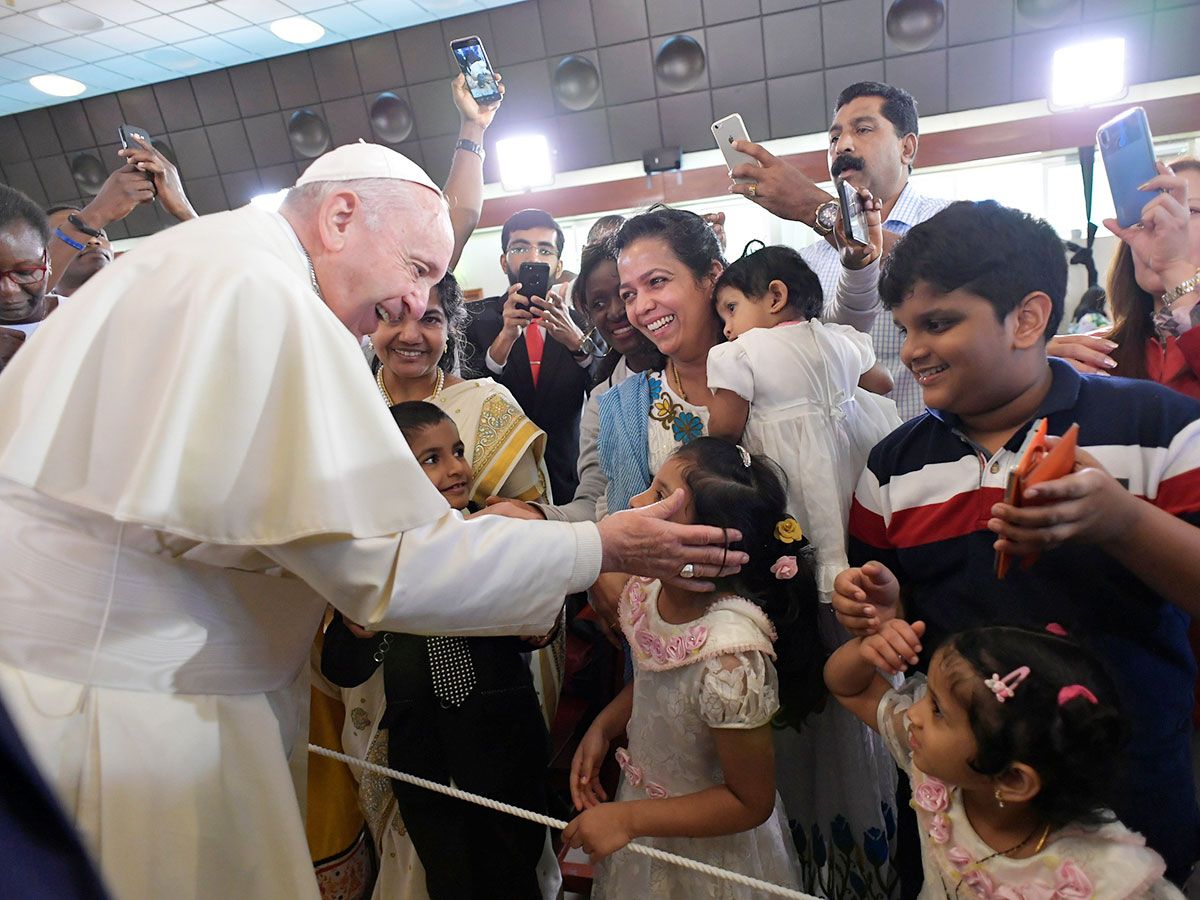 Pope Francis greets people