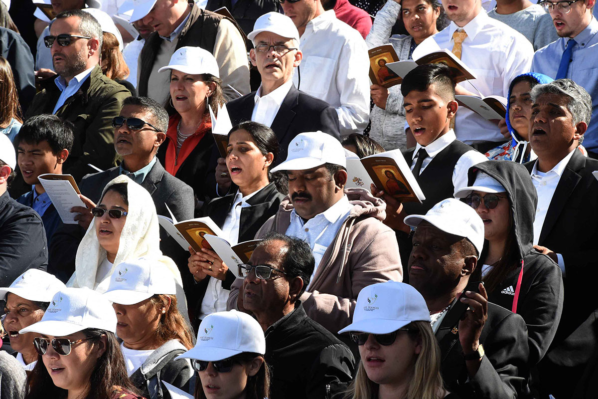 Worshippers pray during a mass