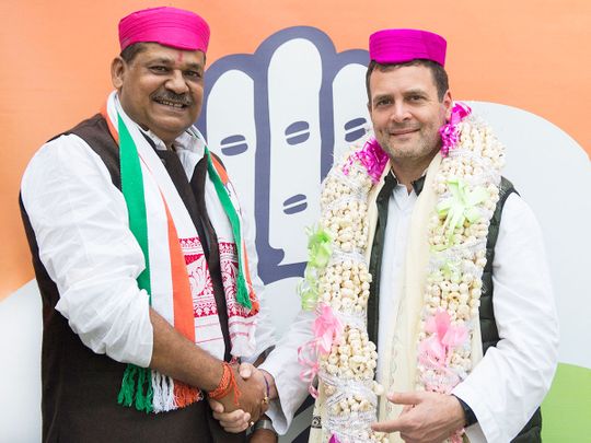 Congress President Rahul Gandhi with inducts cricketer-turned politician Kirti Azad