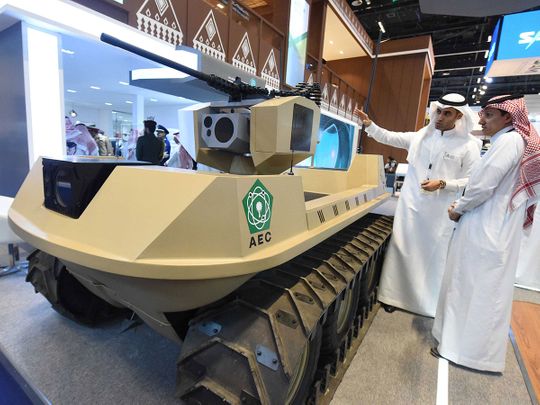 The visitors look at 'UGV' unmanned vehicle