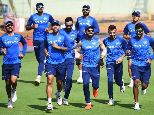 Indian cricket team's captain Virat Kohli (C) with teammates