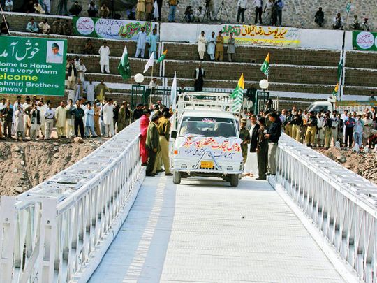 A vehicle crosses the bridge