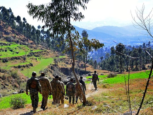 Pakistani soldiers patrol