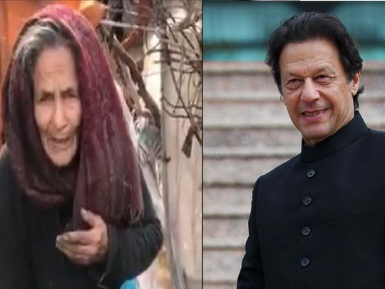 Khan helps elderly woman