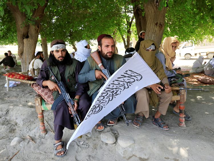 Taliban men gather to celebrate ceasefire