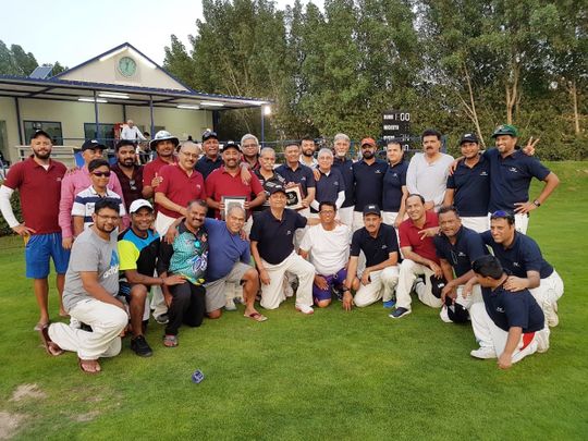 Indian Veterans and Armchair Boys team with the trophies