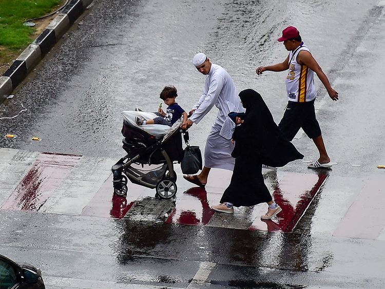 People caught in the rain in Sharjah