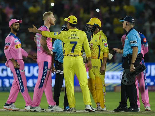 CSK captain M S Dhoni talks to the umpires