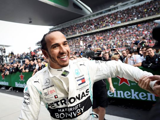 Mercedes' British driver Lewis Hamilton celebrates