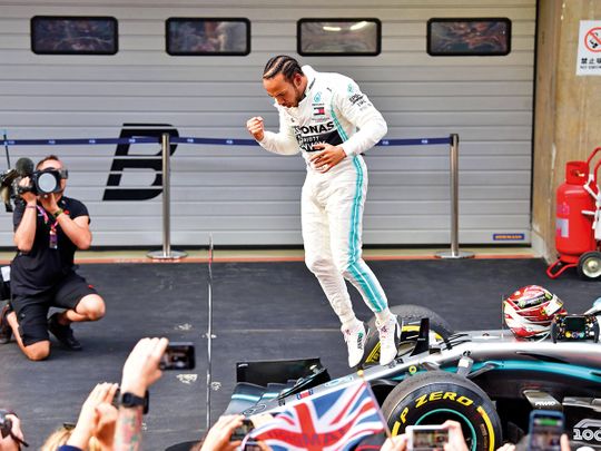 Mercedes' British driver Lewis Hamilton celebrates 7
