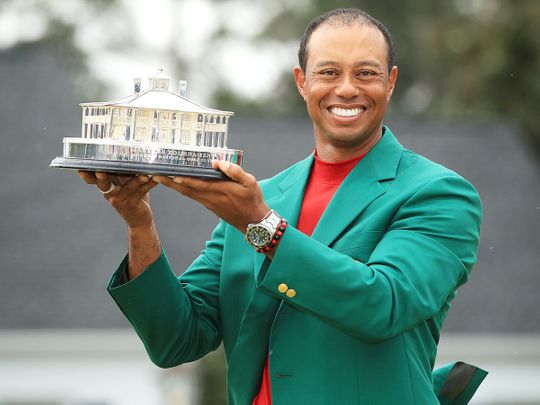Tiger Woods celebrates with the Masters Trophy