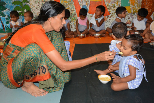 Teacher-feeding-nutritious-meal-to-a-creche-child-1555497893485