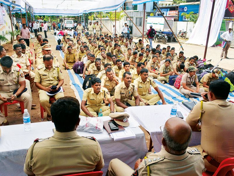 Police officers attend a briefing