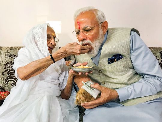 Prime Minister Narendra Modi is offered sweets