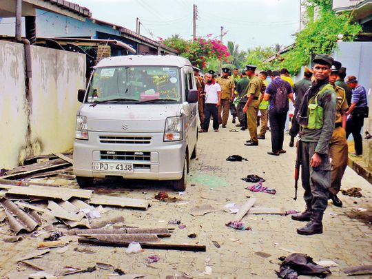 Sri Lankan police and army soldiers secure