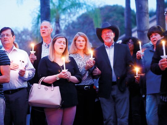 Mourners, including Poway Mayor Steve Vaus