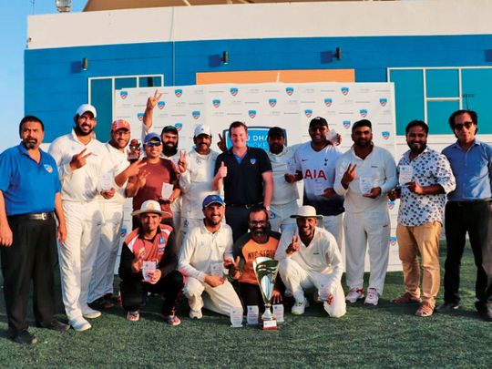 White Hunters team pose with the winners trophy