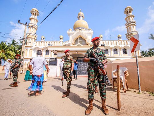Sri Lankan security personnel stand guard