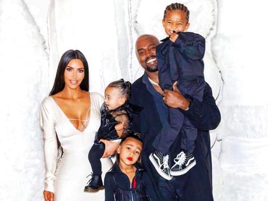 Kim Kardashian and Kanye West with their children North, Saint and Chicago West.