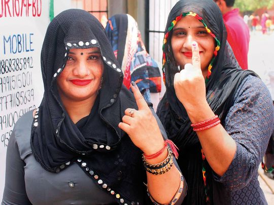 Voters show their fingers marked with indelible ink