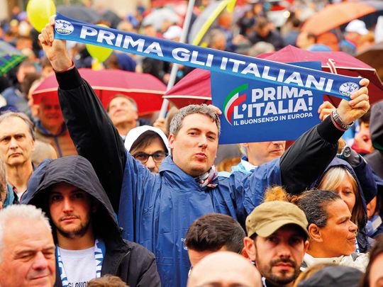 People attend a rally organised by League leader Matteo Salvini