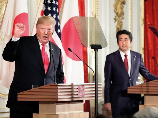 Donald Trump speaks as Shinzo Abe