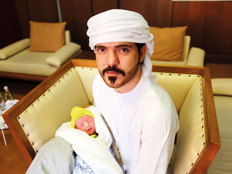 Mohammad Yasser Al Shaikh with his baby Ali