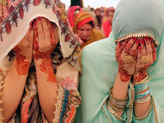 Women pray on the Eid Al Fitr