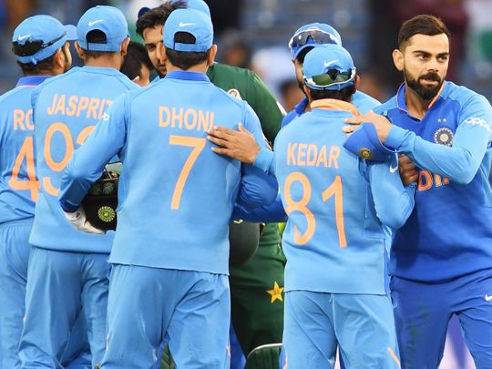 India's captain Virat Kohli (R) celebrates