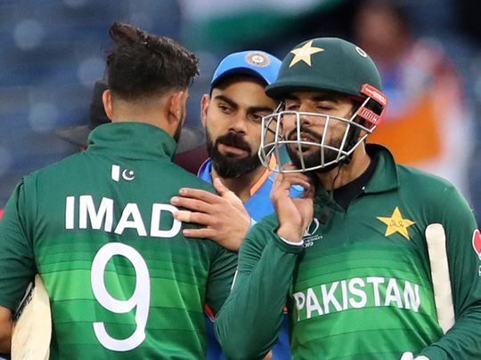 India's Virat Kohli greets Pakistan players