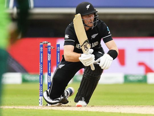 New Zealand's Martin Guptill knocks the bails off his own stumps