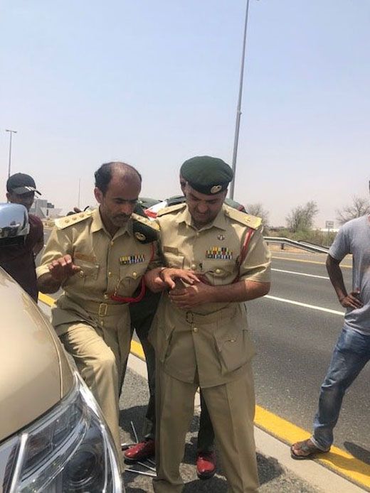 Dubai Police changing a tyre