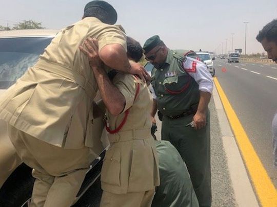 Dubai Police officers offer help
