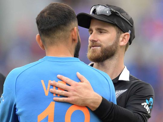 New Zealand's captain Kane Williamson (R) greets India's captain Virat Kohli