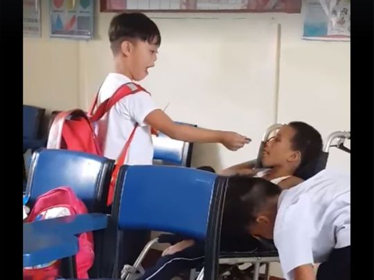 Special needs boys taking care of each other